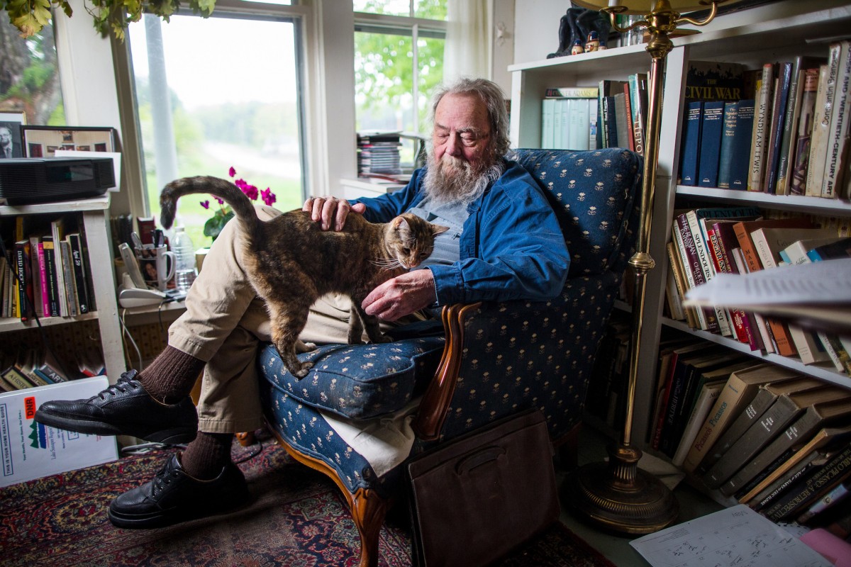 photo of donald hall in his study with a cat