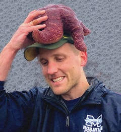 Dr. Joshua Lord with a marine creature atop his head