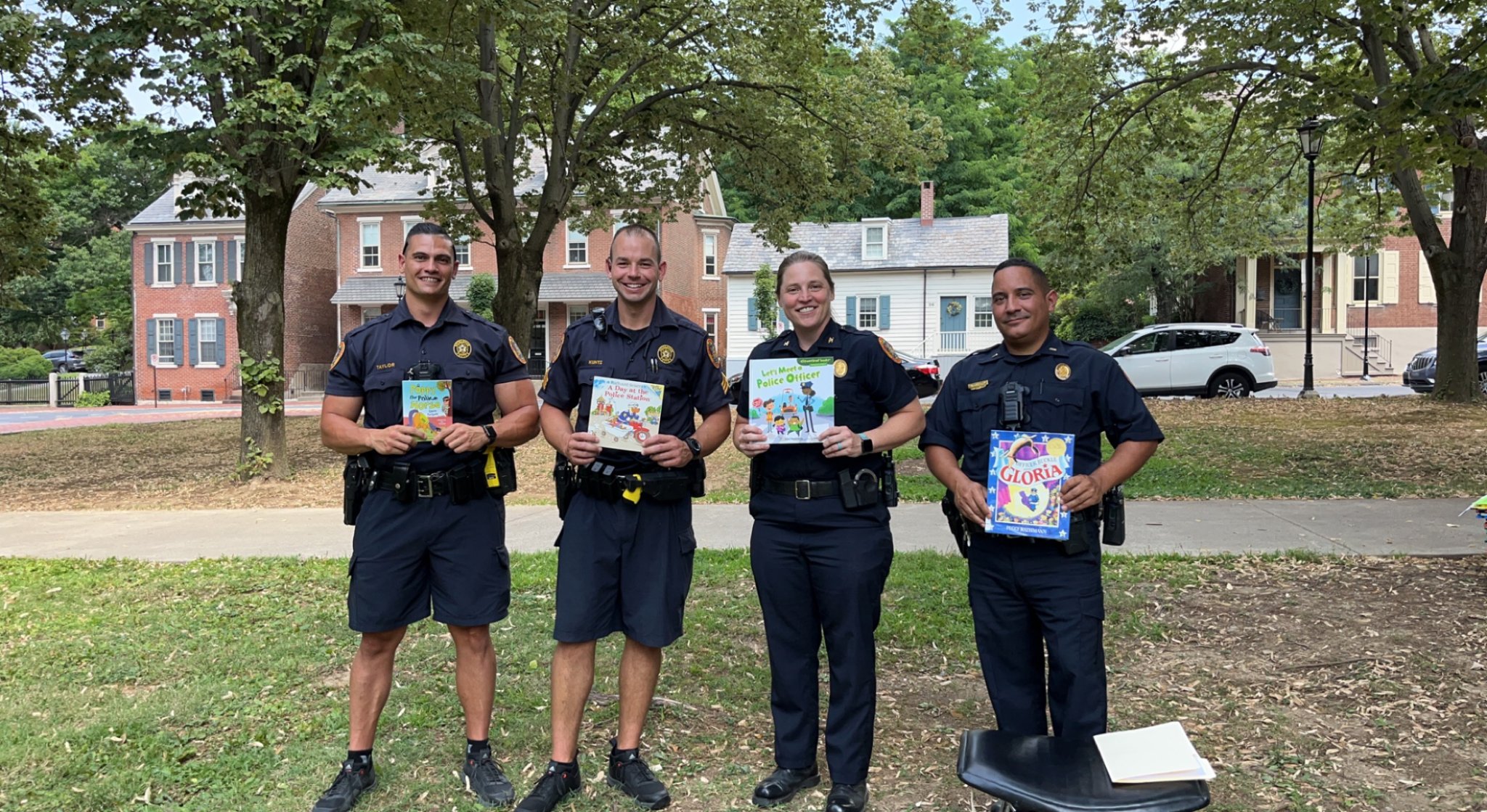 Four Bethlehem City Police Officers hold up books they read! 