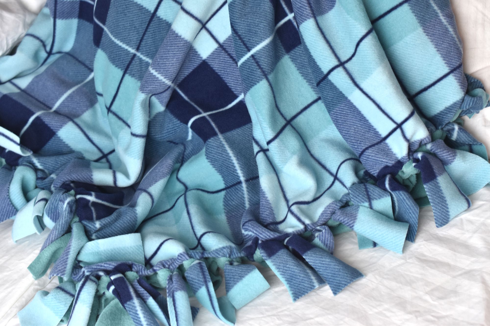 A blue flannel tie blanket