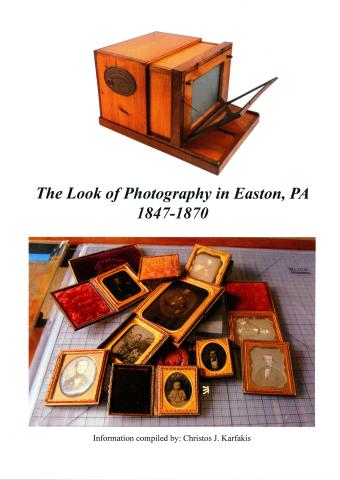 An antique box camera and an assortment of historic daguerreotype photographs.