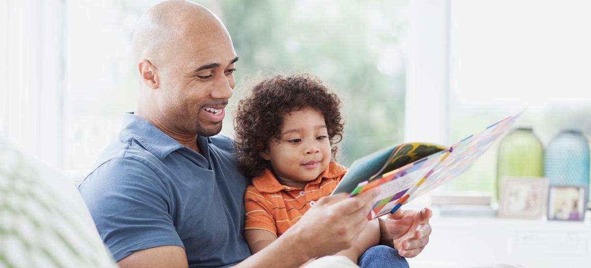 A father reading to his son