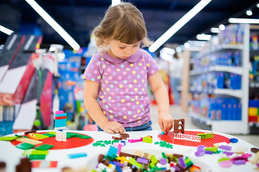 Child playing with LEGOs