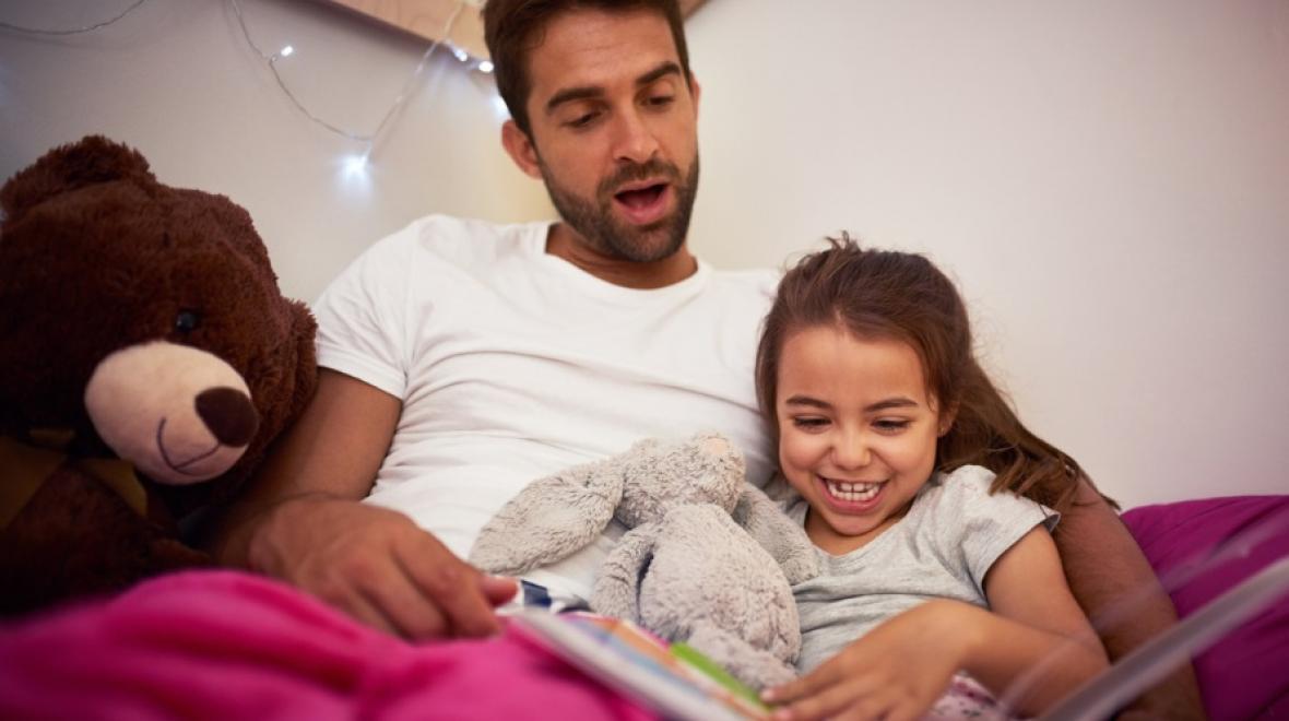 Dad reading with kid