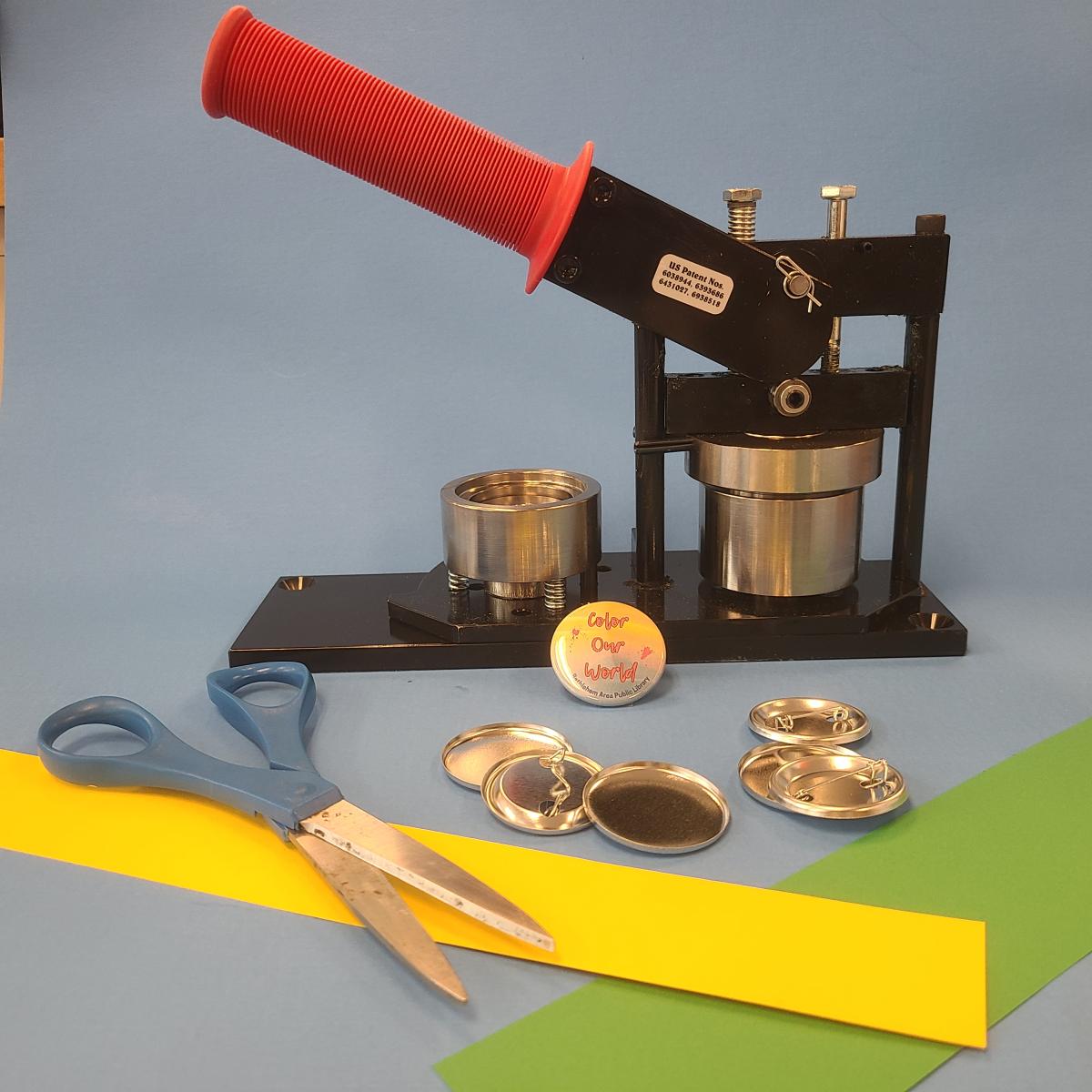 Button maker, scissors, and sample pinback buttons