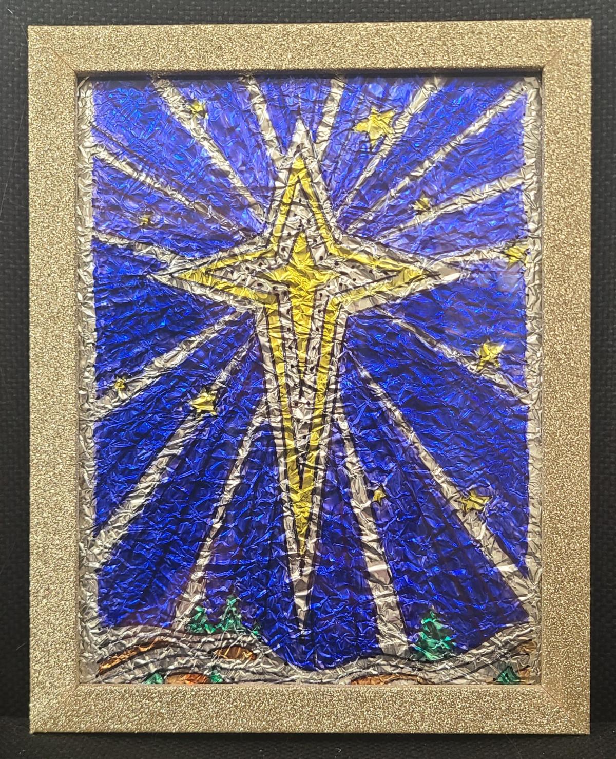 A gold and silver star on a blue background